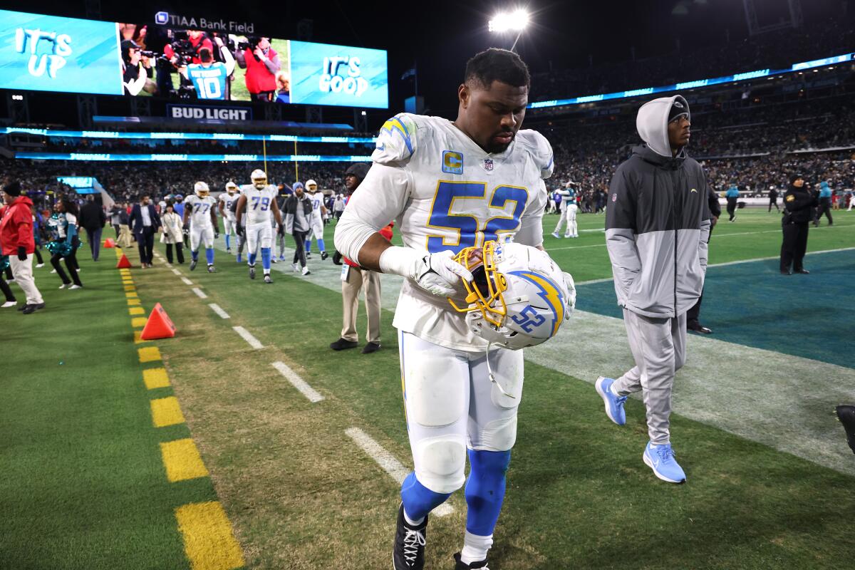 Chargers linebacker Khalil Mack (52) walks off the field in Jacksonville after a playoff loss.