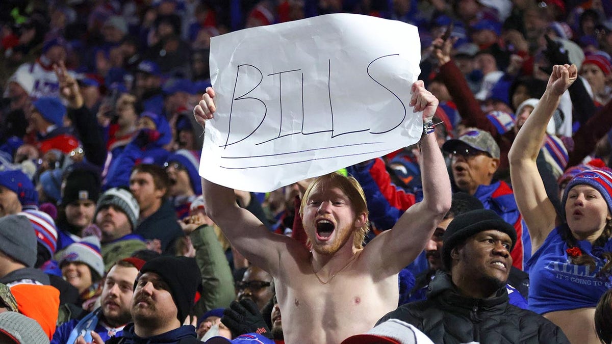 Bills fan holds up sign in stands