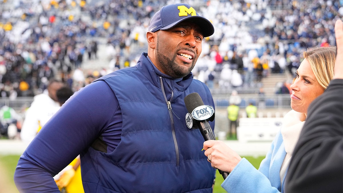 Sherrone Moore conducts postgame interview